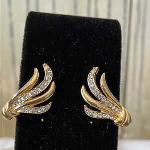 vintage gold-tone clip-on earrings with a layered "wing," or "swirl" motif